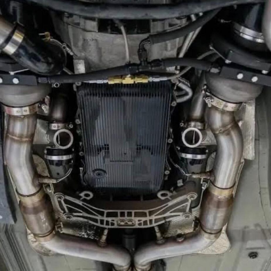 Underside view of a car's exhaust system and suspension components.
